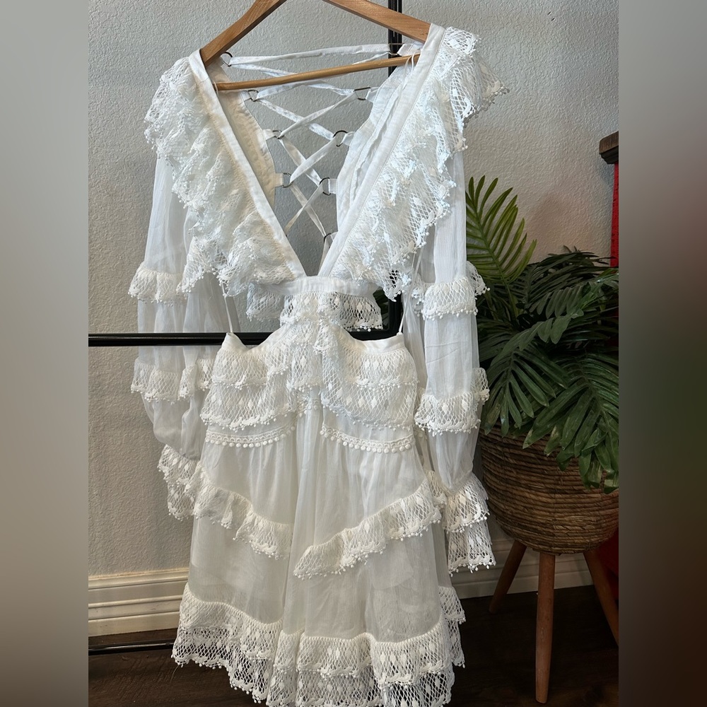 Beautiful, elegant, chic white ruffle, lace dress.